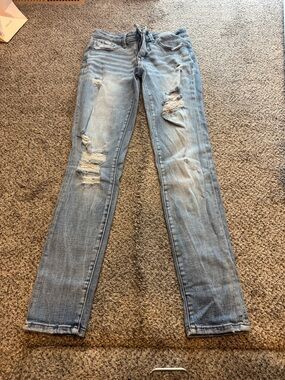 Buckle black skinny jeans